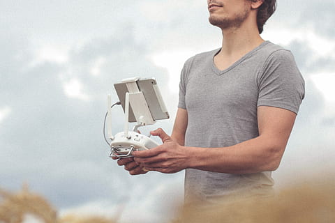 man, holding, white, gray, drone controller, quadcopter controller, drone equipment, equipment, remote, drone, closeup, phantom 4 pro, drone pilot, pilot, remote control, phantom 4, male, faceless, technology, modern, modern technology, one person, men, young men, casual clothing, young adult, t-shirt, cloud - sky, standing, front view, lifestyles, sky, males, adult, nature, waist up, mid adult men, 2K, CC0, public domain, royalty free