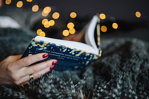 young, woman, home reading hygge book, drinking, at home, reading, Hygge, book, home, indoor, femine, cosy, cozy, fairy lights, people, human Hand, one Person, women, holding, one woman only, adults only, close-up, only women, hand, human body part, selective focus, night, christmas, real people, illuminated, adult, nature, body part, indoors, tree, holiday, communication, christmas lights, finger, 5K