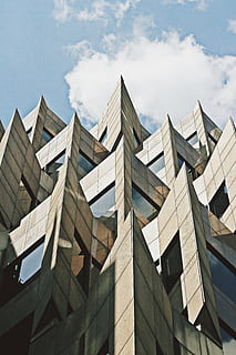 concrete glass building, architecture, building, infrastructure, structure, establishment, windows, hotel, design, corner, cloud - sky, sky, building exterior, abstract, built structure, city, outdoors, day, no people, low angle view, nature, modern, office, office building exterior, pattern, sunlight, tall - high, glass - material, architectural feature, skyscraper, 5K, CC0, public domain, royalty free