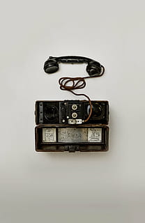 black, telephone, white, surface, electronic, technology, communication, old-fashioned, old, studio shot, indoors, no people, white background, connection, single object, still life, number, close-up, time, gray background, text, directly above, cut out, clock, copy space, economy, 8K, CC0, public domain, royalty free