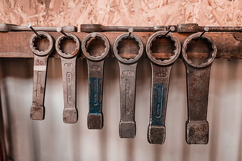 gray wrenches, hanging, stainless, steel tools, tools, order, tool, wrench, spanner, workshop, wood - Material, old, antique, old-fashioned, in a row, no people, indoors, science, day, close-up, variation, work tool, group of objects, choice, side by side, wall - building feature, medium group of objects, nostalgia, leather, 8K, CC0, public domain, royalty free