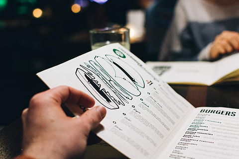 choosing, menu, bar, close up, hands, restaurant, people, document, human Hand, men, holding, close-up, business, one person, human body part, paper currency, finance, hand, paper, leisure activity, unrecognizable person, activity, publication, table, reading, selective focus, focus on foreground, book, text, leisure games, real people, finger, 5K