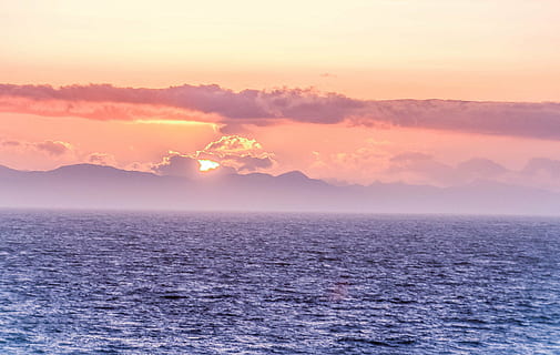 sunset, ocean, sea, clouds, nature, holidays, sky, warm, landscape, beauty in nature, environment, cloud - sky, sun, scenics - nature, tranquility, sunlight, mountain, fog, water, horizon, morning, idyllic, no people, freedom, horizon over water, outdoors, power in nature, 2K, CC0, public domain, royalty free