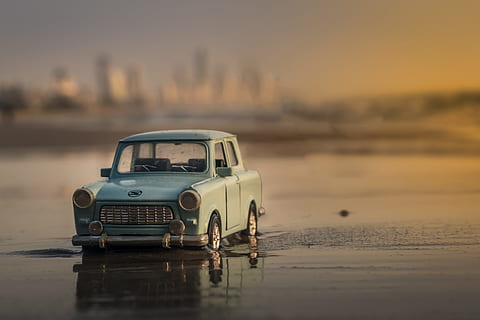 miniature, car, beach, on the beach, various, outdoors, old-fashioned, land Vehicle, sunset, dusk, water, sea, reflection, waterfront, transportation, mode of transport, no people, mode of transportation, sky, motor vehicle, nature, land, retro styled, travel, selective focus, day, 2K, CC0, public domain, royalty free