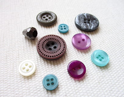 buttons, needlework, design, hobby, textiles, stitching, tailor, work, indoors, choice, variation, no people, multi colored, table, still life, close-up, button, group of objects, art and craft, high angle view, medium group of objects, collection, pink color, blue, plastic, circle, creativity, 4K, CC0, public domain, royalty free