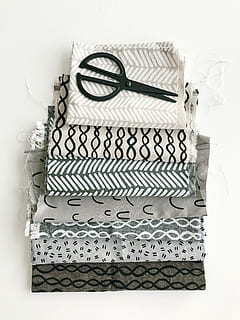 black, scissors, top, textiles, fabric, pattern, flat lay, textile, craft, scissor, white, gray, grey, black and white, create, artisan, crafting, quilting, indoors, white background, no people, still life, table, white color, studio shot, close-up, art and craft, high angle view, directly above, box, box - container, technology, creativity, wall - building feature, equipment, design, ribbon - sewing item, floral pattern, 4K, CC0, public domain, royalty free