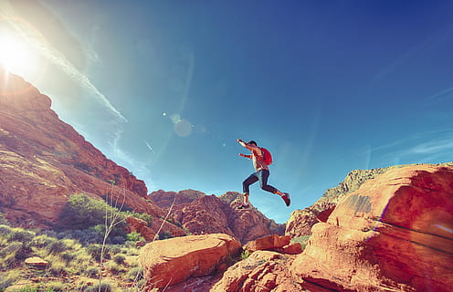 man, person, jumping, desert, rocks, stones, one person, solid, sky, rock, nature, leisure activity, rock - object, full length, sport, sunlight, mountain, motion, beauty in nature, lifestyles, adult, young adult, scenics - nature, adventure, freedom, human arm, human limb, lens flare, outdoors, 5K, CC0, public domain, royalty free