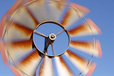 windmill, summer, breeze, wind, motion, countryside, rustic, rural, blurred motion, circle, geometric shape, spinning, no people, blue, sky, shape, speed, time, long exposure, studio shot, clear sky, nature, close-up, single object, metal, architecture, accuracy, clock, clock face, blue background, concentric, 2K, CC0, public domain, royalty free