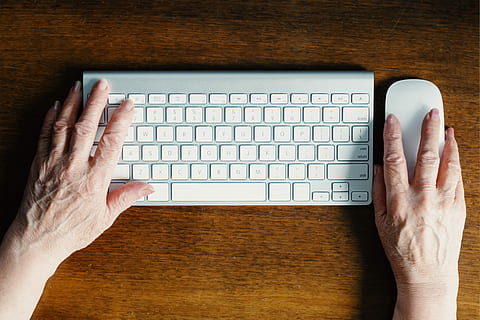 person, holding, white, computer mouse, keyboard, brown, wooden, board, hands, mouse, elderly, table, desk, wood, apple, tech, woman, old, human hand, human body part, computer equipment, hand, computer keyboard, computer, communication, directly above, indoors, high angle view, technology, one person, finger, body part, human finger, connection, men, wireless technology, typing, 4K, CC0, public domain, royalty free
