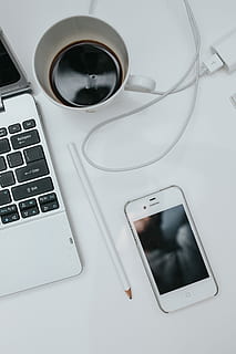 white, desk, Laptop computer, interior, minimal, workspace, workplace, tech, computer, technology, work, notebook, laptop, working, scandi, scandinavian, smart Phone, mobile Phone, telephone, apple Computers, iphone, wireless Technology, mobility, business, internet, modern, computer Monitor, communication, equipment, touch Screen, no People, table, iphone 6, computer keyboard, connection, computer equipment, keyboard, high angle view, portable information device, indoors, refreshment, drink, still life, directly above, silver colored, computer key, 5K