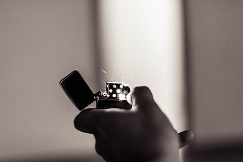 light, black-and-white, man, person, action, adult, blur, close-up, fire, flick, hand, indoors, lighter, motion, sparks, zippo, human hand, one person, human body part, holding, diamond - gemstone, jewelry, ring, body part, finger, focus on foreground, engagement ring, technology, human finger, communication, copy space, 5K