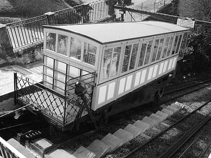 elevator, water, train, architecture, built structure, high angle view, railing, day, staircase, building exterior, real people, outdoors, rail transportation, men, track, nature, steps and staircases, railroad track, railroad station, transportation, lifestyles, plant, tree, 2K, CC0, public domain, royalty free