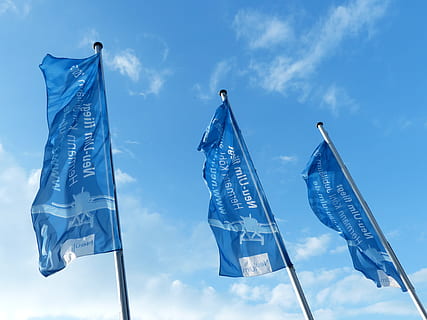 flags, blue, blow, flutter, sky, flagpoles, hoist, hoisted, cloud - sky, flag, low angle view, nature, no people, day, wind, environment, outdoors, pole, group of objects, three objects, in a row, hanging, representation, shape, variation, 4K, CC0, public domain, royalty free