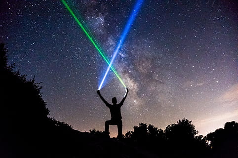 dark, night, sky, cloud, stars, bright, light, tree, plant, people, man, alone, flashlight, star - space, one person, silhouette, space, astronomy, galaxy, standing, nature, leisure activity, scenics - nature, beauty in nature, human arm, real people, lifestyles, star field, arms raised, limb, human limb, milky way, 4K, CC0, public domain, royalty free