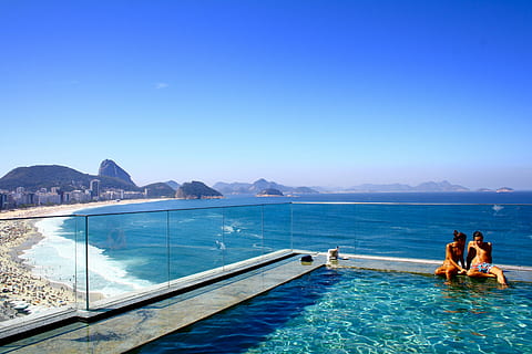 couple, corner, swimming, pool, high, rise building, ocean view, people, shore, blue-sky, daytime, \, swimming pool, high rise building, water, vacations, sea, outdoors, nature, blue, sky, summer, travel Destinations, travel Locations, color Image, luxury, togetherness, heterosexual couple, relaxation, women, two people, mountain, adult, couple - relationship, leisure activity, sitting, copy space, love, scenics - nature, trip, 4K, CC0, public domain, royalty free