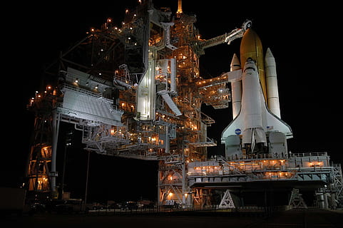 white, brown, space rocket, day time, launch pad, rocket launch, night, space shuttle, discovery, nasa, launch preparation, technology, machine, 2005, illuminated, industry, no people, building exterior, architecture, built structure, factory, nature, fuel and power generation, business, outdoors, refinery, sky, oil industry, travel destinations, transportation, container, nautical vessel, 2K, CC0, public domain, royalty free