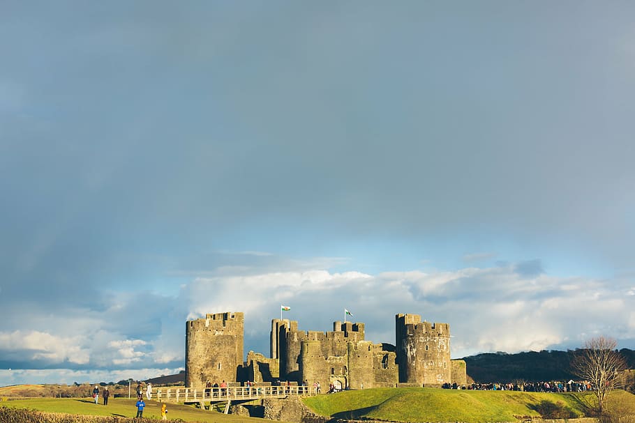 gray concrete castle, gray, concrete, castle, green, grass, pathway, flag, pole, building, structure, people, historic site, mountain, nature, view, landscape, sky, clouds, sunny, summer, sunlight, sunrise, history, architecture, built structure, the past, building exterior, old ruin, ancient, day, cloud - sky, travel destinations, travel, fort, tourism, no people, outdoors, ancient civilization, ruined, archaeology, skyscraper, 1080P