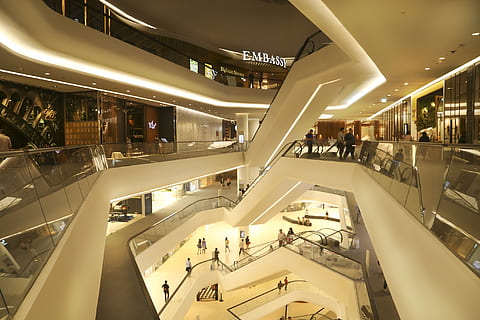 beige painted building, central embassy, mall, store, escalators, shop, bangkok, luxury, shopping, consumerism, department store, architecture, modern, indoors, escalator, business, shopping mall, illuminated, real people, lifestyles, built structure, group of people, men, incidental people, railing, large group of people, travel, women, leisure activity, retail, ceiling, architectural column, 2K, CC0, public domain, royalty free