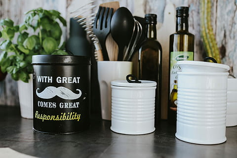 kitchen utensils, cans, wall, Kitchen, utensils, containers, cooking, spoon, chopping board, spatula, bottle, jar, variation, can, indoors, large group of objects, container, still life, no people, table, food and drink, choice, text, close-up, food, arrangement, western script, day, group, focus on foreground, 4K, CC0, public domain, royalty free