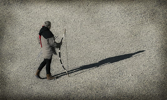 person, holding, composite, bow, onion, arrows, archer, the bowstring, arrow, quiver, one person, shadow, full length, real people, day, nature, sunlight, land, lifestyles, men, casual clothing, high angle view, outdoors, walking, leisure activity, city, adult, standing, 4K, CC0, public domain, royalty free
