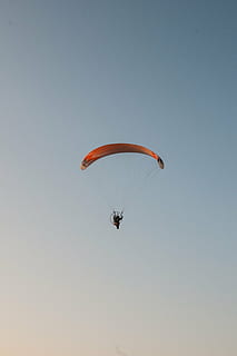 flight, parachute, wind, extreme Sports, flying, sport, parachuting, action, adventure, paragliding, sky, gliding, air, skydiving, activity, hobbies, recreational Pursuit, mid-Air, blue, risk, leisure Activity, outdoors, fun, unrecognizable person, exhilaration, low angle view, clear sky, freedom, joy, one person, transportation, nature, real people, lifestyles, sports activity, excitement, 4K, CC0, public domain, royalty free