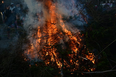 easter fire, branches, leaves, fire, green, easter, burning, fire - natural phenomenon, land, heat - temperature, nature, flame, smoke - physical structure, plant, no people, orange color, field, environmental issues, high angle view, pollution, tree, outdoors, environment, forest, motion, bonfire, air pollution, 5K, CC0, public domain, royalty free