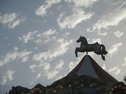 carousel, horse, sky, cloud - sky, low angle view, architecture, built structure, nature, representation, sculpture, art and craft, religion, no people, day, animal representation, place of worship, belief, statue, building exterior, spirituality, history, outdoors, 4K, CC0, public domain, royalty free