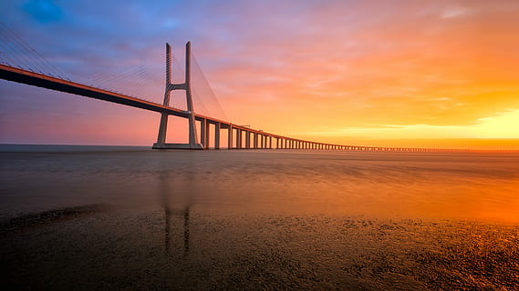 paisatges del pont, posta de sol, ampli, foto d'angle, Pont en suspensió, pont, estructura, arquitectura, aigua, cel, mar, pont - estructura feta per l'home, connexió, transport, núvol - cel, estructura construïda, naturalesa, destinacions de viatge, platja, escenics - natura, cel dramàtic, terra, horitzó, bellesa a la natura, horitzó sobre l’aigua, cap gent, a l'aire lliure, sol, badia, 5K, CC0, domini públic, lliure de regalies