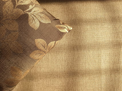 brown, design, color, surface, background, cushion, fabric, pillow, sunlight, textile, pattern, indoors, clothing, close-up, human body part, textured, body part, one person, fashion, backgrounds, still life, high angle view, directly above, material, full frame, yellow, freshness, softness, floral pattern, textured effect, 4K, CC0, public domain, royalty free