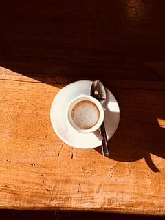 white, cup, saucer, spoon, brown, table, ceramic, teacup, foamy, liquid, drink, wood, mug, coffee, coffee - drink, coffee cup, food and drink, refreshment, still life, crockery, wood - material, indoors, kitchen utensil, freshness, high angle view, no people, directly above, frothy drink, wood grain, non-alcoholic beverage, 2K, CC0, public domain, royalty free