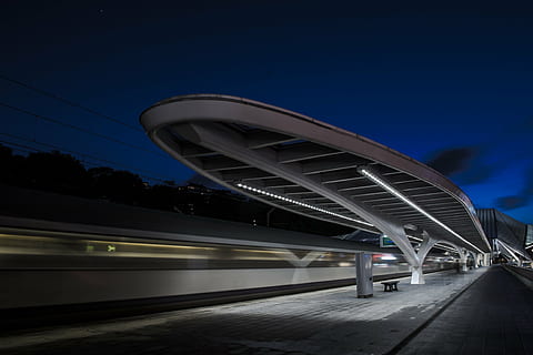 gray, concrete, subway station, blue, sky, architecture, bench, blur, evening, lights, metro, motion, night, platform, public transportation, seat, station, subway, train, train station, bridge - man made structure, transportation, road, speed, connection, highway, light trail, city, built structure, illuminated, railroad station, mode of transportation, rail transportation, modern, train - vehicle, building exterior, bridge, no people, outdoors, subway train, 4K, CC0, public domain, royalty free