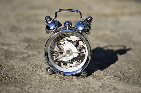 Watch, Alarm Clock, Time, Clock, Dial, time, clock, clockwork, design, old, accuracy, glass, shadow, white cat, glitter, closeup, background, single object, sand, old-fashioned, no people, day, land, close-up, number, metal, sunlight, beach, nature, outdoors, motorcycle, still life, blue, selective focus, silver colored, personal accessory, 2K, CC0, public domain, royalty free