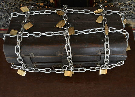 brown chest box, strong box, chains, locks, box, strength, padlock, secure, steel, closed, metal, protect, protection, safe, safety, security, safeguard, shield, safeguarding, crime, prevention, trunk, locked, chain, lock, old, hanging, no people, close-up, indoors, necklace, belief, religion, connection, spirituality, jewelry, cross, architecture, pendant, decoration, wall, positive emotion, silver colored, ornate, 4K, CC0, public domain, royalty free