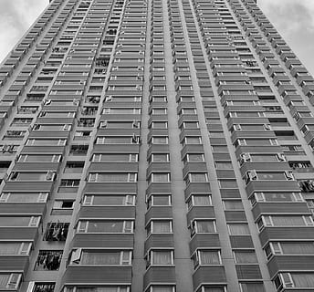 bottom view, gray, building, architecture, infrastructure, structure, establishment, apartment, windows, condominium, hotel, black and white, monochrome, building exterior, built structure, city, low angle view, window, tall - high, no people, day, office building exterior, skyscraper, in a row, modern, repetition, sky, outdoors, cloud - sky, residential district, 2K, CC0, public domain, royalty free