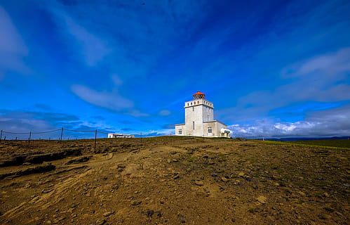 landscape, nature, sky, clouds, architecture, blue, cloudy, daylight, grass, lighthouse, outdoors, rocks, scenic, tower, built structure, building exterior, building, cloud - sky, land, no people, guidance, low angle view, environment, scenics - nature, direction, travel destinations, eroded, 4K, CC0, public domain, royalty free