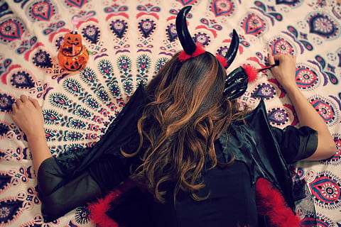 person, wearing, black, dress, devil, horn, lying, area rug, black dress, area, rug, women, one Person, females, people, caucasian Ethnicity, indoors, beauty, beautiful, fashion, young Adult, adult, bed, lifestyles, comfortable, long hair, arms raised, human arm, limb, hair, real people, hairstyle, furniture, rear view, lying down, leisure activity, high angle view, brown hair, pattern, relaxation, floral pattern, 1080P, CC0, public domain, royalty free