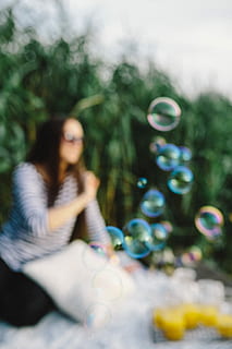 fun, soap bubbles, nature, Having fun, girl, summer, woman, holidays, vacations, bubbles, happy, women, outdoors, people, females, blowing, young Adult, lifestyles, caucasian Ethnicity, bubble, beauty, adult, happiness, beautiful, relaxation, one Person, cheerful, smiling, bubble Wand, cute, park - Man Made Space, enjoyment, playful, joy, playing, leisure Activity, sitting, one woman only, only women, one young woman only, adults only, real people, young women, selective focus, vulnerability, plant, fragility, three quarter length, day, front view, hairstyle, 4K