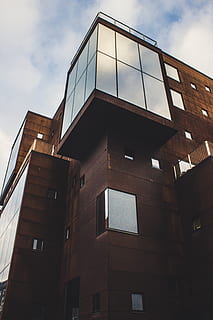 building, architectural design, architecture, clouds, exterior, facade, futuristic, glass, glass items, glass windows, low angle shot, modern, outdoors, sky, steel, tall, urban, windows, built structure, low angle view, building exterior, cloud - sky, nature, window, no people, day, city, glass - material, residential district, office, reflection, office building exterior, apartment, 4K