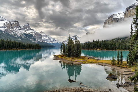 body, water, surrounded, pine trees, foot, snow, covered, mountain, daytime, lake, mountain ranges, tree, reflection, forest, scenics - nature, beauty in nature, cloud - sky, sky, plant, environment, tranquility, nature, mountain range, tranquil scene, no people, landscape, coniferous tree, outdoors, snowcapped mountain, pine tree, reflection lake, formation, 5K, CC0, public domain, royalty free