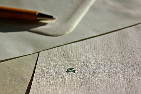 white paper, letters, leave, envelope, luck, four leaf clover, new year greeting, communication, paper, stationery, write letters, envelopes, pen pal, pen, font, penpal, correspondence, background, lucky clover, symbol of good luck, symbol, new year's day, happy new year, greetings, post, neujahr embassy, greeting, congratulations, white, message, writing tool, no people, indoors, high angle view, still life, close-up, writing instrument, table, heart shape, art and craft, creativity, shadow, fountain pen, wood - material, focus on foreground, letter, selective focus, document, pattern, 2K, CC0, public domain, royalty free