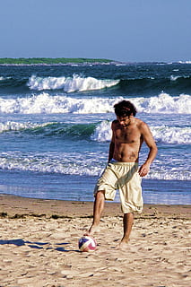 young, play, ball, beach, soccer, sea, waves, heat, shirtless, water, land, full length, one person, lifestyles, leisure activity, sport, men, nature, motion, day, standing, wave, real people, muscular build, outdoors, shorts, 1080P, CC0, public domain, royalty free