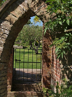 arch, gate, ruin, path, garden, plant, architecture, tree, built structure, no people, day, nature, growth, wall, building exterior, building, outdoors, wall - building feature, protection, green color, window, entrance, security, metal, brick, stone wall, 2K, CC0, public domain, royalty free