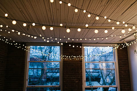turned-on string lights, window, interior, design, ceiling, lights, bulb, electricity, bricks, wall, indoor, indoors, no people, multi colored, luxury, architecture, modern, illuminated, day, space, lighting equipment, low angle view, business, reflection, corporate business, glass - material, wealth, built structure, light - natural phenomenon, decoration, technology, night, light, stage, 2K, CC0, public domain, royalty free