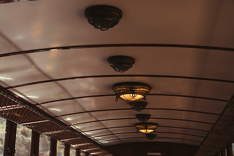 ceiling lights, bus, black, dome, lights, ceiling, train, windows, transport, travel, indoors, built structure, no people, focus on foreground, architecture, illuminated, close-up, day, low angle view, lighting equipment, hanging, light, electricity, electric light, chandelier, in a row, pendant light, design, pattern, decoration, glowing, electric lamp, light fixture, 5K, CC0, public domain, royalty free