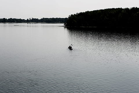 grayscale photo, boat, body, water, black, near, island, canoe, kayak, paddle, lake, outdoors, nature, people, waterfront, reflection, tranquility, tranquil scene, beauty in nature, day, nautical vessel, transportation, mode of transportation, scenics - nature, tree, one person, real people, sky, non-urban scene, men, unrecognizable person, rowing, 5K