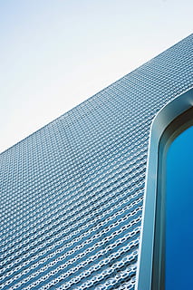 high, angle photography, gray, concrete, building, low-angle photo, metal building, geometric, looking up, pattern, architecture, modern, abstract, structure, blue sky, curve, window, metal, cladding, texture, sky, low angle view, clear sky, building exterior, day, blue, nature, built structure, no people, copy space, tall - high, outdoors, sunlight, office building exterior, city, swimming pool, skyscraper, silver colored, directly below, 5K, CC0, public domain, royalty free