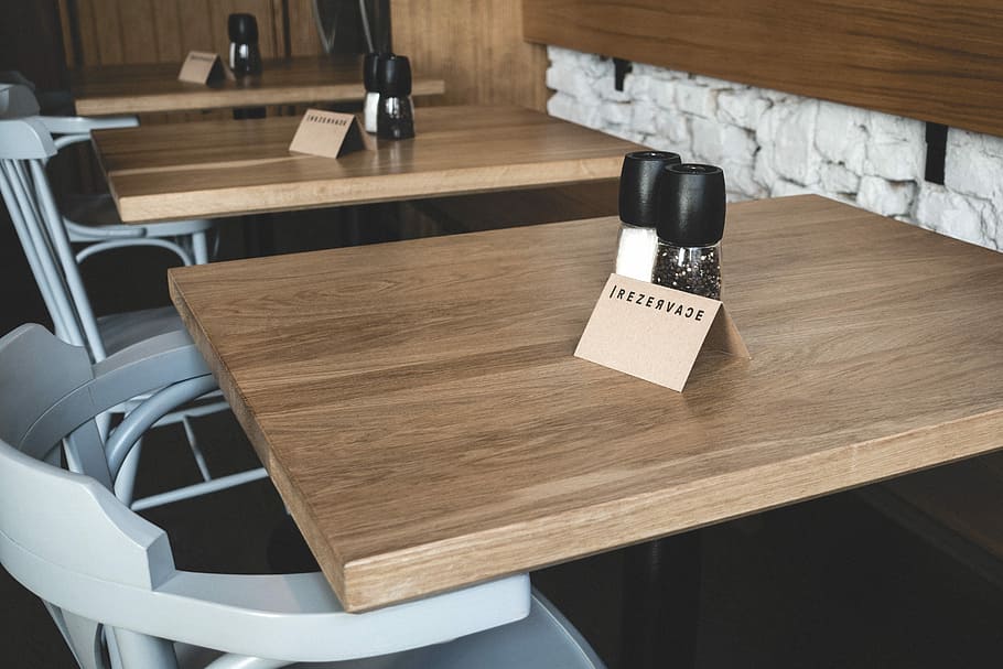 table, restaurant, Booked, interior, desk, indoors, wood - Material, chair, furniture, no People, business, retail, day, technology, text, communication, domestic room, home interior, western script, seat, home, absence, high angle view, wood, sign, architecture, 5K