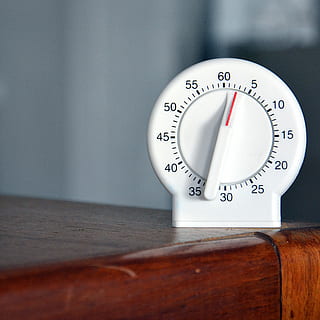 black, white, analog egg timer, whie control knob, timer, clock, table, wooden, nurse, number, wood - material, indoors, no people, time, still life, close-up, accuracy, instrument of measurement, communication, shape, wall - building feature, geometric shape, instrument of time, selective focus, circle, gauge, text, minute hand, 4K, CC0, public domain, royalty free