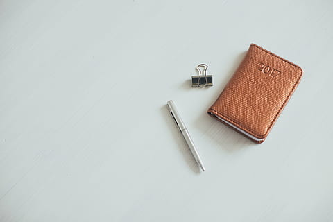 2017, brown, planner, beside, clip, pen, white, panel, notebook, notes, diary, calendar, year, binder, table, write, business, studio shot, white background, no people, close-up, day, indoors, copy space, high angle view, still life, orange color, equipment, metal, silver colored, tool, diy, art and craft, white color, communication, two objects, work tool, home improvement, 5K, CC0, public domain, royalty free