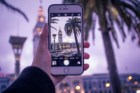 person, holding, silver iphone 6, taking, photo, building, left, hand, silver, iphone, s, plus, picture, camera, tree, cellphone, phone, smartphone, travel, technology, mobile, tech, focus on foreground, photographing, communication, adult, adults only, city, one person, illuminated, photography themes, human hand, human body part, wireless technology, portable information device, architecture, smart phone, activity, street, city life, connection, 5K, CC0, public domain, royalty free